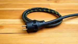 15 amp extension lead showcased against a wooden background, highlighting its durable braided design and high IP66 rating for outdoor use.