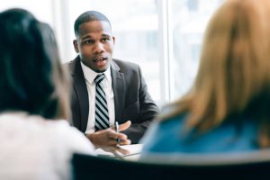 Consultant-sitting-with-potential-clients-for-Web